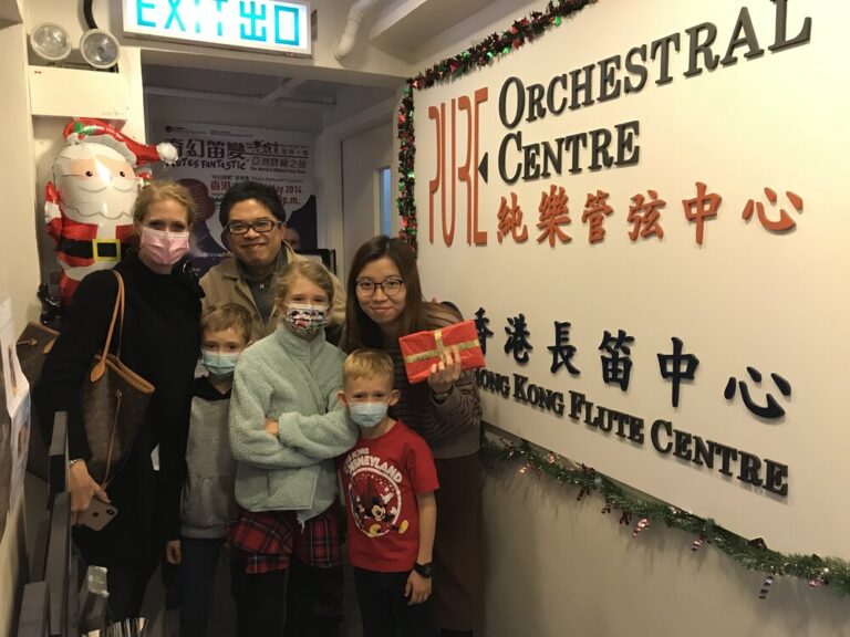 A group photo with Ringo, the director of PURE, Linda, an instructor here, as well as their fellow students and parents.