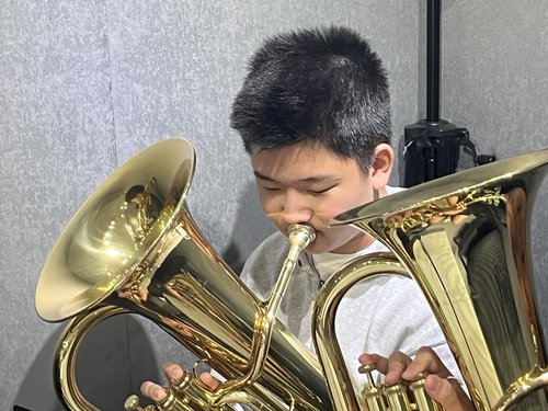 Look out for how focused he is when playing his instrument!