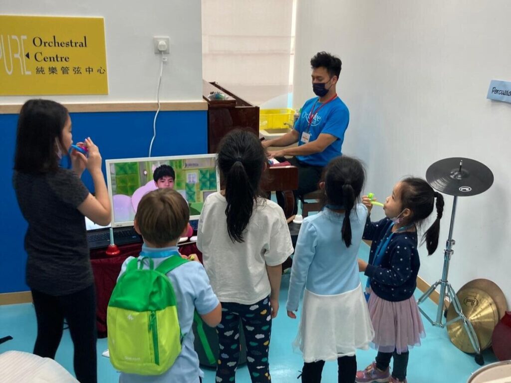 Here, Nigel is teaching a with many fellow students.