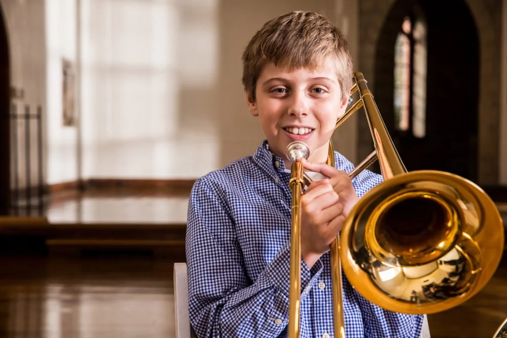 Davis is playing his own trombone, look how much he enjoys it!