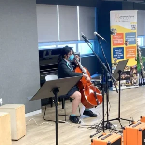 A student is having her cello music lesson at NAISHK.