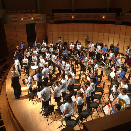 A large group of musicians are performing in a student concert held by PURE.