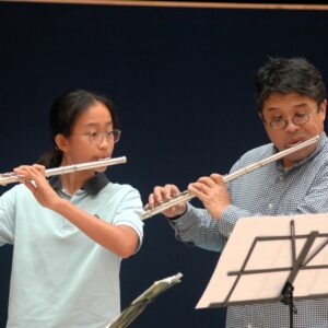 Ringo and another student are performing together with their flutes.
